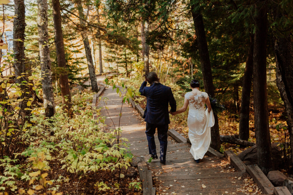 elopement outdoors hiking photo of bride and groom walking in to the distance on the trail 
