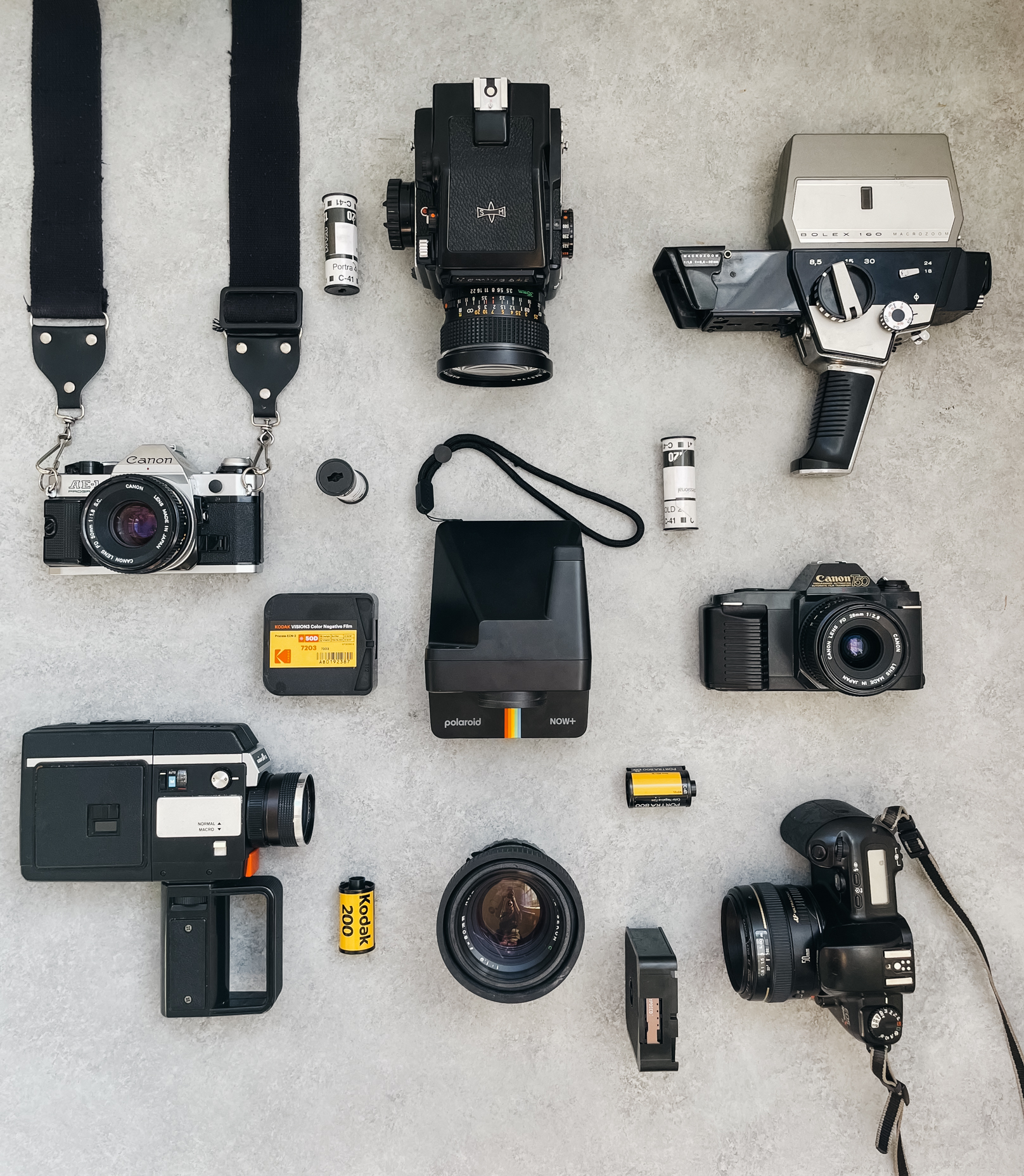 top down photograph of a variety of film and digital cameras